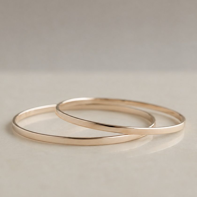 After — two solid gold bangles