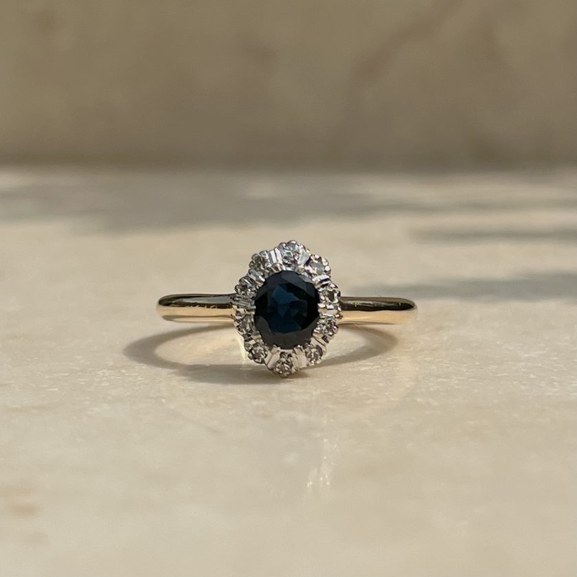 After — the same sapphire and stones reset on a slim band